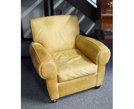 A Pottery Barn Manhattan Easy Chair, in light tan cowhide