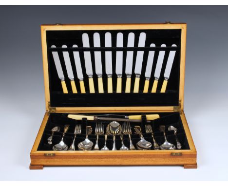 A mid-century walnut cased canteen of silver plated flatware Old English pattern, six place settings, including ivorine handl