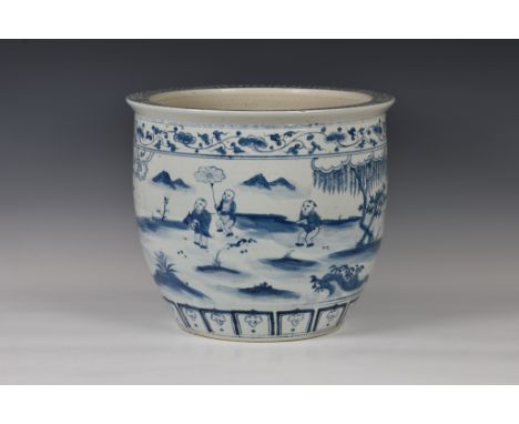 A large Chinese blue and white porcelain fish bowl 19th / early 20th century, painted with seven boys in a fenced garden, on 