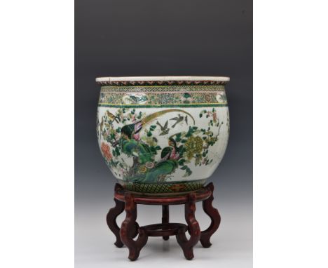 A large Chinese famille rose verte porcelain fish bowl probably 19th century, circular form, painted with two peacocks and ot