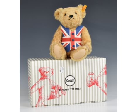 Steiff/Danbury Mint teddy bear. Golden mohair, wearing union jack waistcoat. Steiff button on ear. Jointed limbs. Height appr