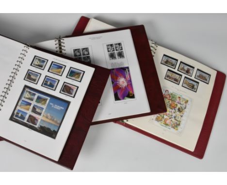 Philately interest - Stanley Gibbons / Guernsey mint stamp albums contained in three albums, from mint Occupation stamps thro