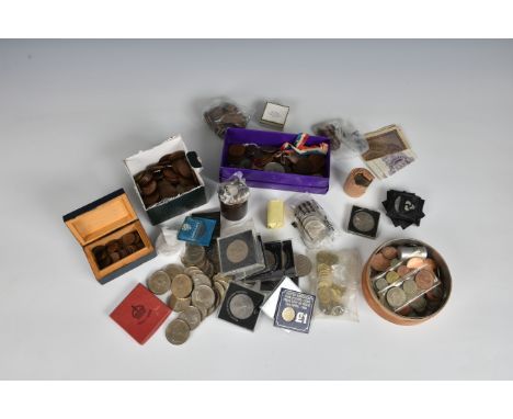 A large collection of vintage coinage to include two cased Jersey £1 square coins; two cased Guernsey proof coin collections,