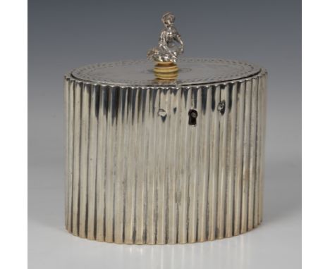 A George III silver tea caddy Robert Hennell I, London 1784, of reeded, oval form, the hinged lid with punched band to edge a