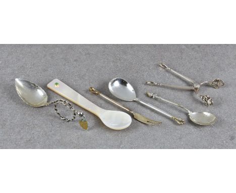 A pair of Georg Jensen silver sugar tongs Acorn pattern, with foliate bowls, sprung hinge, impressed marks, 3¾in. (9.25cm.) l