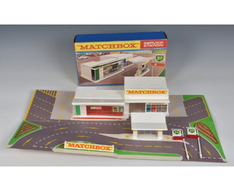 A boxed Matchbox 1-75 Series MG-1 Service Station (BP) produced 1967-1969, with white plastic building and accessories and fo