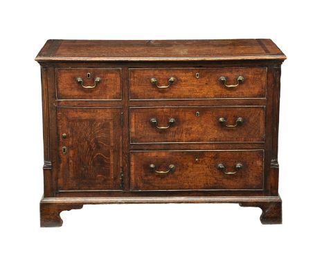 A George III mahogany-cross-banded oak chest of drawers the rectangular top over a single short drawer and a bank of three gr