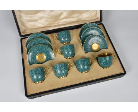 A Royal Worcester porcelain cased demitasse set decorated with a textured shagreen effect finish, underglaze puce marks to ba