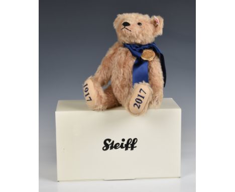 Steiff teddy bear - celebrating The House of Windsor Centenary Blonde mohair, with embroidered pawpads and wears a blue ribbo