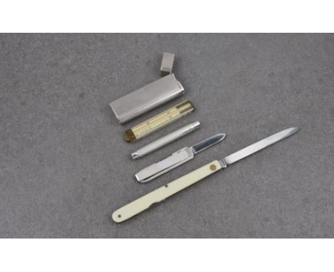 A George V silver cased propelling pencil and folding rule Cohen &amp; Charles, London 1934, in the form of a lighter, with e