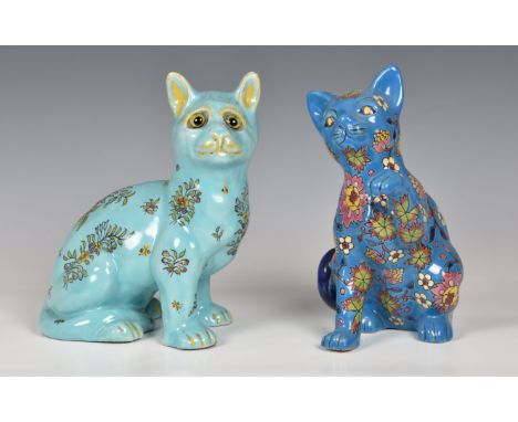 A French pottery Galle style cat seated, turquoise glazed with painted sprays of flowers and inset glass eyes, painted mark, 