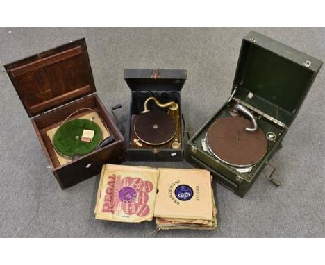 Three vintage portable gramophones together with 78 records and spare winding keys. 