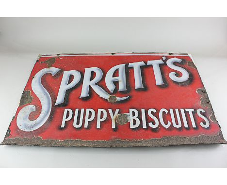 An enamel advertising sign for Spratt's Puppy Biscuits (a/f) 50cm by 76cm