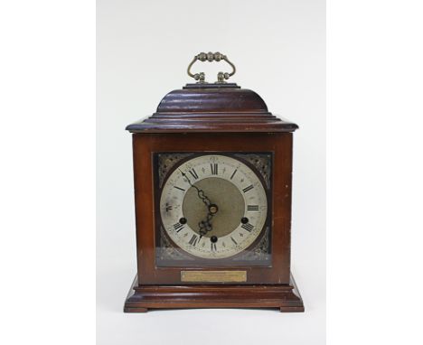 A Smiths mahogany cased bracket clock, the eight day movement striking Westminster chimes, presented to "L. Dawson by the Dir