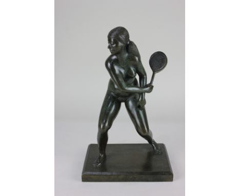 A Kenneth Child bronze sculpture of a naked figure playing tennis, signed and dated 1987, 30.5cm