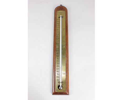 An S &amp; A Calderara, London wall thermometer, mounted on brass on oak, 40cm
