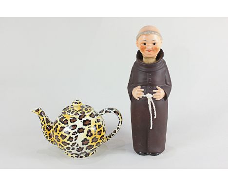 A Paul Cardew Leopard print porcelain teapot, the base marked Cardew Designs, together with a Goebel Friar Tuck decanter 27cm
