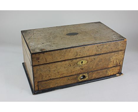 A burr walnut games box, containing draughts, chess set (missing black pawn), cribbage, playing cards and whist markers