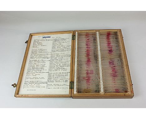 A box of glass microscope slides, containing various samples of tissue, from Guy's hospital, London