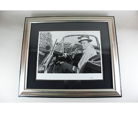 Frank Worth (American 1923-2000) a black and white photographic print of Frank Sinatra in Ford Thunderbird 1953, limited edit