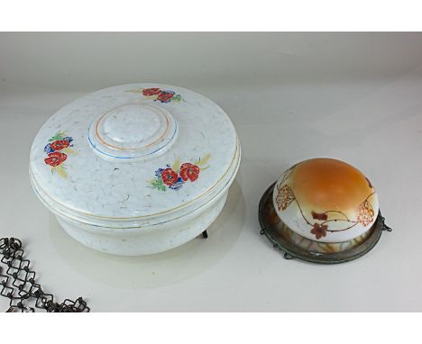 Two glass ceiling light shades, comprising one decorated with red flowers on mottled white ground, 20cm diameter rim, the oth