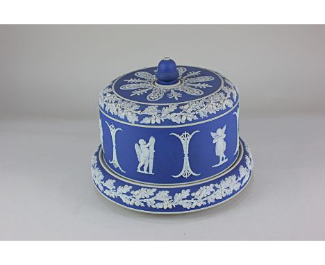 A Victorian Jasperware stilton dish, depicting winged cherubs playing pipes, with acorn and oak leaf border, 20cm high