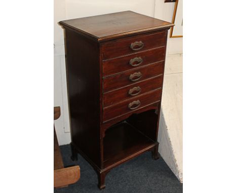 An early 20th century mahogany music cabinet with five drawers with fold-down fronts, above open shelf, 51cm