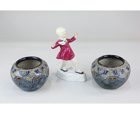 A pair of Royal Doulton glazed stoneware vases, decorated with sinuous tubeline plants on blue-green mottled ground, artist's