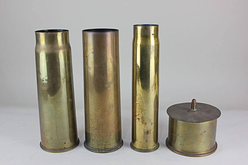 Three first world war brass shell casings, and a trench art shell