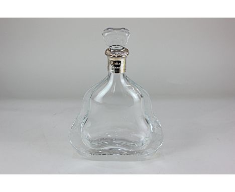 A glass Richard Hennessy cognac decanter, of flattened sinuous form, decorated with a border of fruiting vines, 28.5cm high i