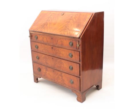 An early 19th century flame mahogany bureau - the cross banded fall front enclosing a simple fitted interior with five drawer