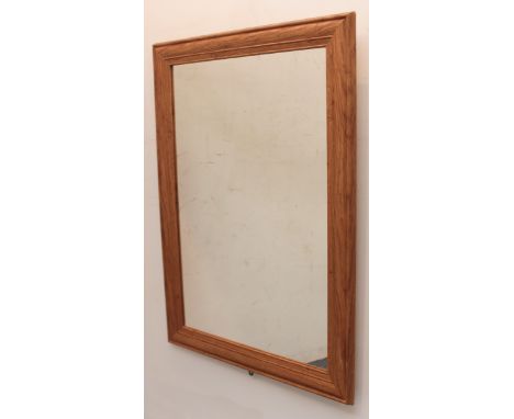 A light-oak-effect mirror - 88 x 63cm.