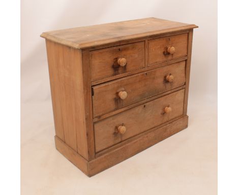 A vintage pine chest of drawers for restoration - two short over two long drawers, raised on a platform base. (99 x 44.5 x 82