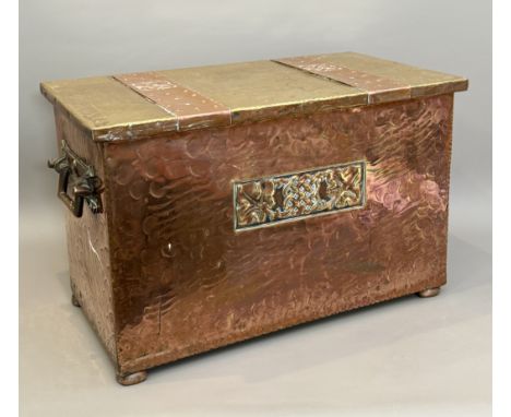 An Arts &amp; Crafts style copper and brass coal box - early 20th century, the planished copper box with an inset brass plaqu
