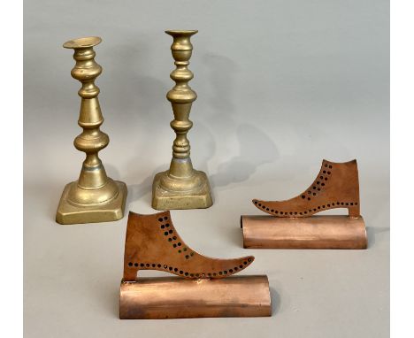A mirrored pair of late 19th century polished copper cobblers shop window advertising signs - the flat, cut-out boots with pu