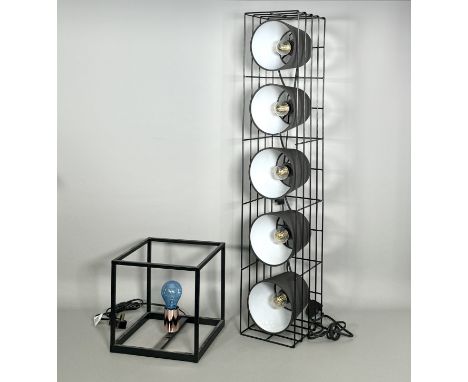 A five-light floor lamp by made.com - the black rectangular cage frame enclosing five black fabric shades with LED filament b