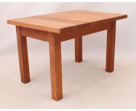 A light oak low children's dining table - square, with plain, square section supports. (LWH 92.5 x 66.5 x 60cm)