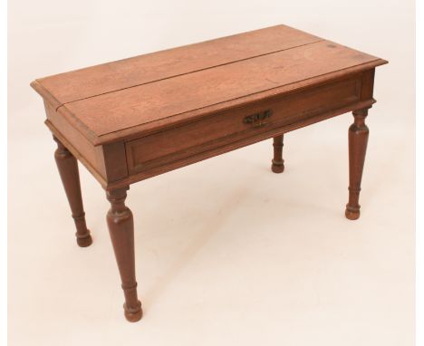 An early 20th century oak low side table - the two-plank moulded top over a single full-length drawer with original handle, r