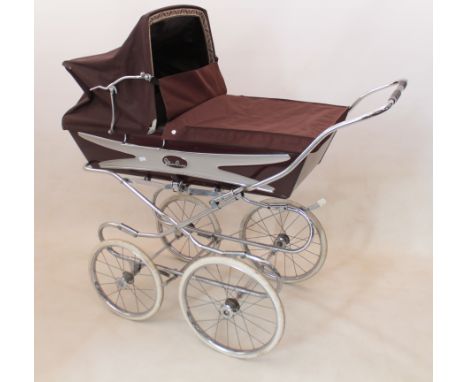 A vintage Silver Cross pram - painted in metallic chestnut brown and pale grey with a chrome sprung chassis and brown hood, t