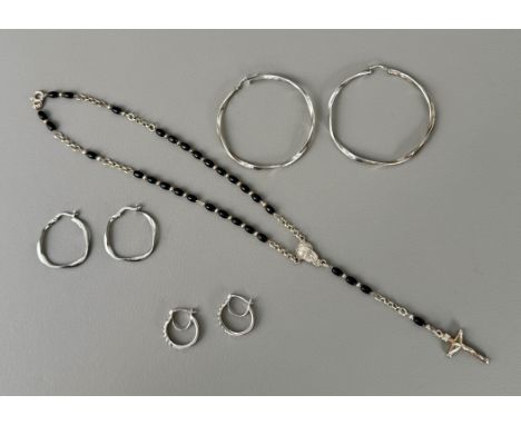 Three pairs of earrings and a crucifix necklace - the largest pair of hoops in sterling silver, stamped '925', 5.9cm diameter