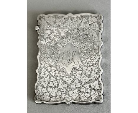 A late-Victorian silver card case - William M. Hayes, Birmingham 1897, with rectangular shaped outline, decorated throughout 