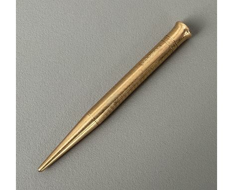 A George V 9ct gold propelling pencil, 'The Mascot' - Birmingham 1931, with engine turned decoration, 9.5cm long.