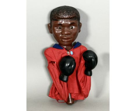 A vintage 1960s-70s plastic Muhammad Ali boxing glove puppet - marked 'Made in Hong Kong', with boxing action, 23cm high, in 