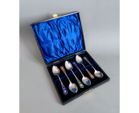 A cased set of six Edwardian silver and enamel coffee spoons - A. J. Bailey, Birmingham 1904, the bright cut stems with flora