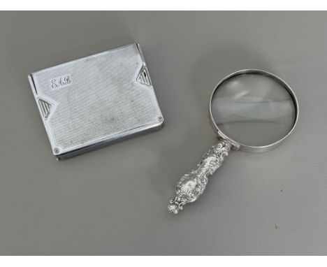 A magnifying glass with white metal handle - 15.4cm long; together with a 1930s-40s Art Deco chrome plated cigarette case, wi