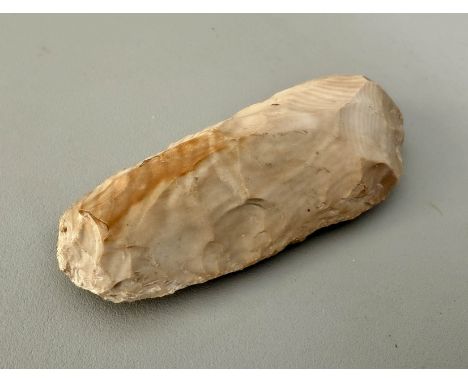 A very ancient worked flint axe head, 12cm long.