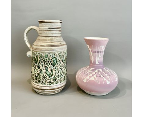 A Navajo earthenware vase by Mesa Verde Pottery, Cortez, Colorado - of bottle form with a flared rim, in a matt pink and mauv