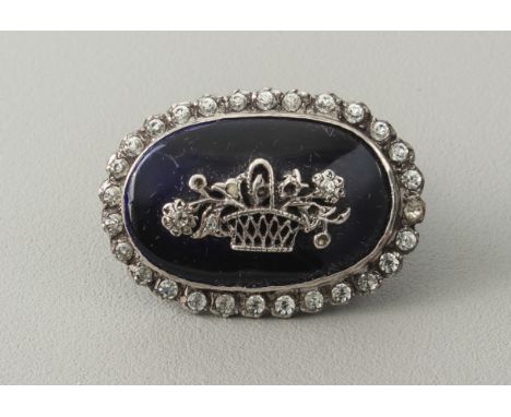 A Victorian style silver, enamel and paste brooch - Harold Arthur Lazarus, London 1951, oval with paste-set floral basket ove