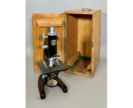 A pair of vintage students microscopes by C. Baker of London - mid-20th century, serial nos. 34146 and 34182 and stamped '194
