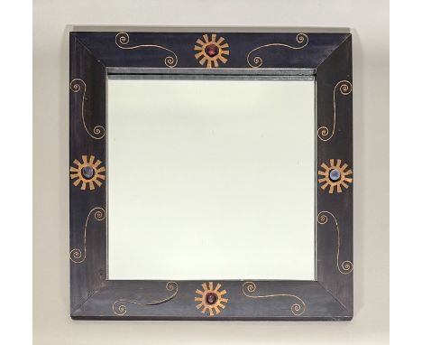 A decorative ebonised mirror - late 20th century, signed and dated (19)'95 verso, the rectangular frame decorated with applie
